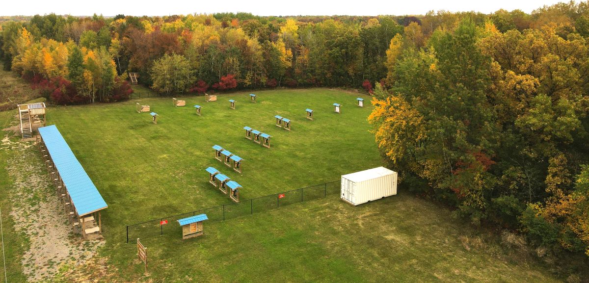 Archery stations with blue roofs